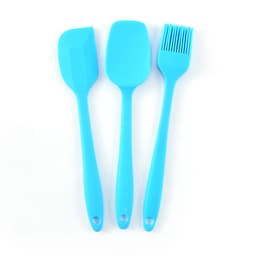 A silicone baking set in bright blue featuring a spatula, spoon, and basting brush, all with long handles.