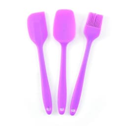 A set of three purple silicone baking utensils, including a spatula, a scraper, and a basting brush.