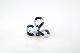A Tangle toy in black and light blue colours, featuring interlocking segments for manipulation.