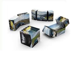 A 6cm medium magic cube featuring multiple images printed on its faces, showcasing various scenic landscapes and cars.