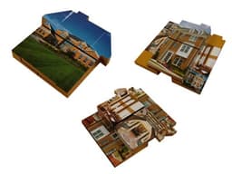 A large puzzle shaped like a house, featuring images of a brick facade and interior rooms in warm colours.