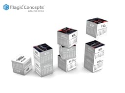A set of six cube calendars in grey and white, featuring images and a logo on the top faces.