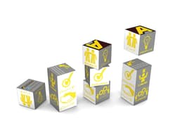 A set of colourful cubes in silver, featuring various symbols and words such as "Respect," "Excellence," and "Creativity."