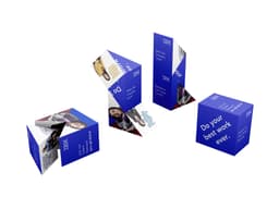 A multi-colored promotional product consisting of triangular promotional blocks featuring images and a logo.