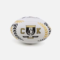 A size 5 rugby ball in white with black and gold detailing, featuring a logo and decorative leaf patterns.
