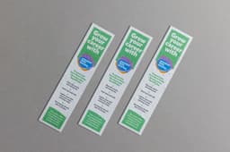 Three large seed paper bookmarks in white with green text and a circular logo, featuring a textured, eco-friendly design.