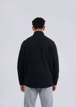 A black men's/unisex polar fleece half zip top displayed from the back, featuring a simple design and a logo.