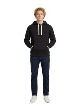 A black heavy fleece hoodie with a drawstring hood and front pockets, worn by a model with light curly hair.