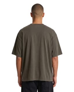 An organic cotton oversized T-shirt in faded olive green, featuring a simple design and a relaxed fit.
