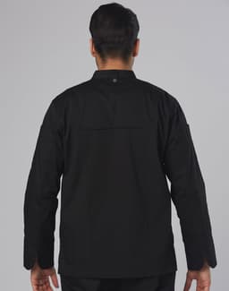 A black men's chef jacket with long sleeves and a collar, featuring a back vent and a logo.