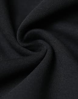 A close-up of fabric in a black, soft, and stretchy material, showcasing a smooth texture.
