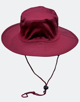 A maroon surf hat with a wide brim and a clip-on chin strap. It features a logo on the side.