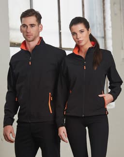 A black softshell jacket with orange highlights, featuring a zip front and pockets, displayed on a male and female model.