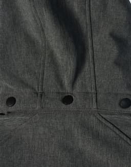 A softshell full zip hoodie in dark grey, featuring snap buttons and a simple design, includes a logo.