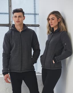 A black heather bonded fleece jacket displayed on models, featuring a zip front and pockets.