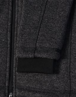 A dark heather grey fleece jacket with a black ribbed cuff and zipper detail. It also features a logo.