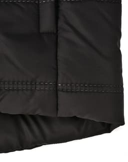A black sustainable seamless parka jacket featuring a 3D cut with visible stitching details. It has a logo.