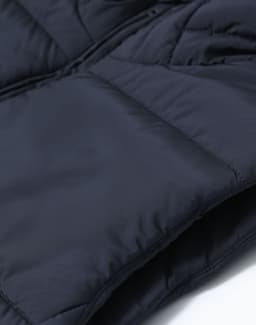 Men's sustainable insulated puffer vest in navy, featuring a soft, textured fabric and a zip closure.