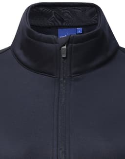 A navy sustainable softshell corporate jacket featuring a zip collar and inner mesh lining, with a brand logo.