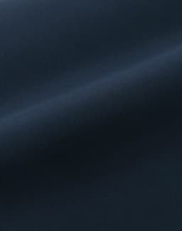 A smooth, dark navy fabric with a sleek finish, showcasing a quilted texture. It has a subtle sheen.