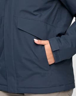 A unisex quilted waterproof jacket in navy blue, featuring a pocket and a close-up of the material.