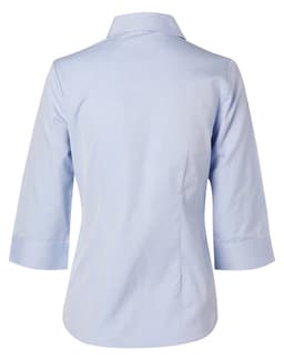 A light blue women's button-up shirt with 3/4 sleeves and a collar, featuring a branding logo.