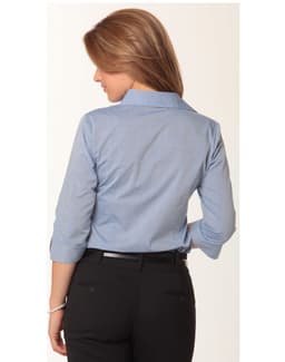 A women's fine chambray shirt in light blue with 3/4 sleeves, featuring a back view and a logo.