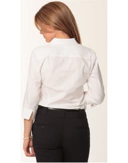A white women's mini herringbone 3/4 sleeve button-up shirt with a back yoke detail. Features include a logo on the side.