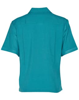 A teal short sleeve overblouse with a collared neck and back pleats, featuring a logo.
