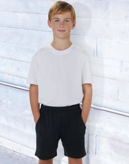 Kids' bamboo charcoal sports shorts in black, styled with a plain white t-shirt, featuring pockets.