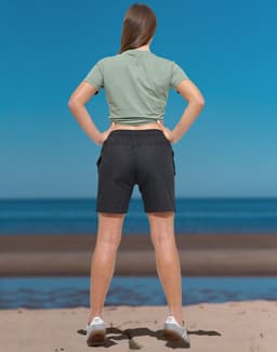 Unisex mercerised cotton shorts in dark colour, featuring a simple design and elastic waistband.