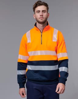 A vibrant orange work jumper with reflective stripes and navy blue accents, featuring a half-zip collar.