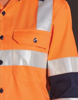 An orange work shirt with reflective silver stripes, featuring a pocket and black sleeves. It includes a logo.