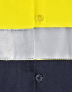 A high-visibility long-sleeve safety shirt featuring yellow fabric with grey reflective tape and dark navy sections.