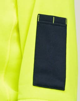 A bright yellow fleece hoodie features a dark navy arm patch and has a visible logo.