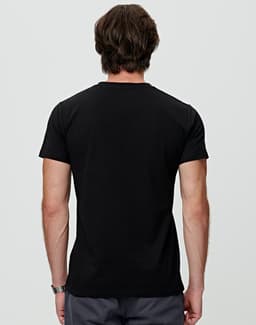 A black premium cotton t-shirt featuring a simple design and short sleeves, with a logo on the back.