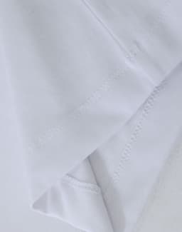 A white premium cotton long-sleeve tee shirt with a smooth finish and visible stitching details.