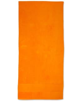 An orange terry velour beach towel, measuring 75x150 cm, with a towel hem and a logo.