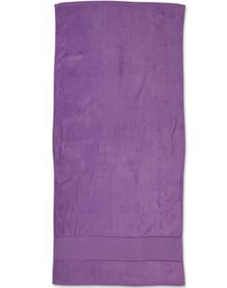 A purple terry velour beach towel measuring 75x150 cm, featuring a plain design with a logo.