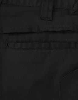 Close-up of black unisex cotton stretch ripstop work shorts, featuring a back pocket and visible stitching details.
