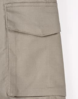 Unisex cotton stretch ripstop work shorts in a light beige colour featuring side pockets and a logo.