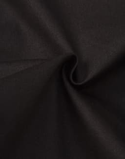 A close-up of black cotton fabric, showcasing a smooth texture and slight stretch. The material appears to be durable.