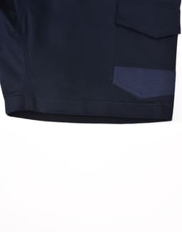 Unisex cotton stretch drill shorts in navy with a pocket detail. Features branding on the garment.