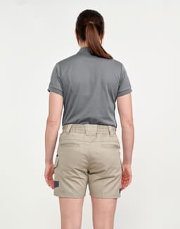 A pair of unisex cotton stretch drill work shorts in khaki, featured with a back view of a person wearing them.