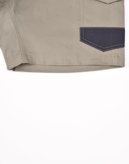 Unisex cotton stretch drill work shorts in khaki with a navy accent pocket. Features a logo on the side.
