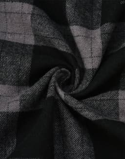 A close-up of black and grey flannel fabric featuring a plaid pattern, showcasing the texture and design.