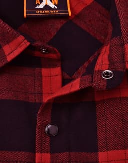 A unisex flannel plaid shirt in red and navy, featuring button details and a collar. It includes a logo tag.