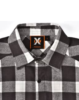 A black and white flannel plaid button-up shirt featuring a collar and a logo on the label.