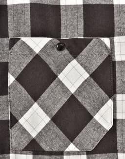 A black and white checked flannel plaid shirt featuring a chest pocket with a button. The fabric has a soft texture.