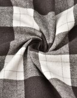 A close-up of grey and white flannel fabric with a plaid pattern, showing the texture and weave.